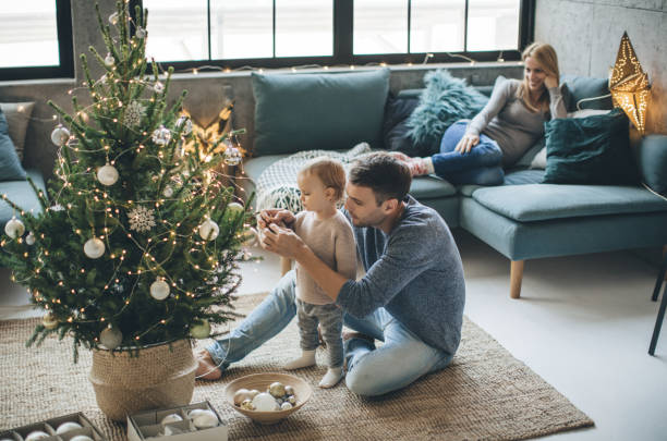 Father and daughter decorate a christmas tree | BFC Flooring & Design Centre